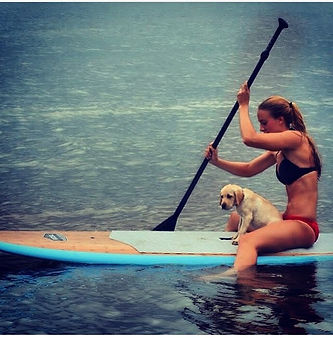 a person riding a surf board on a body of water